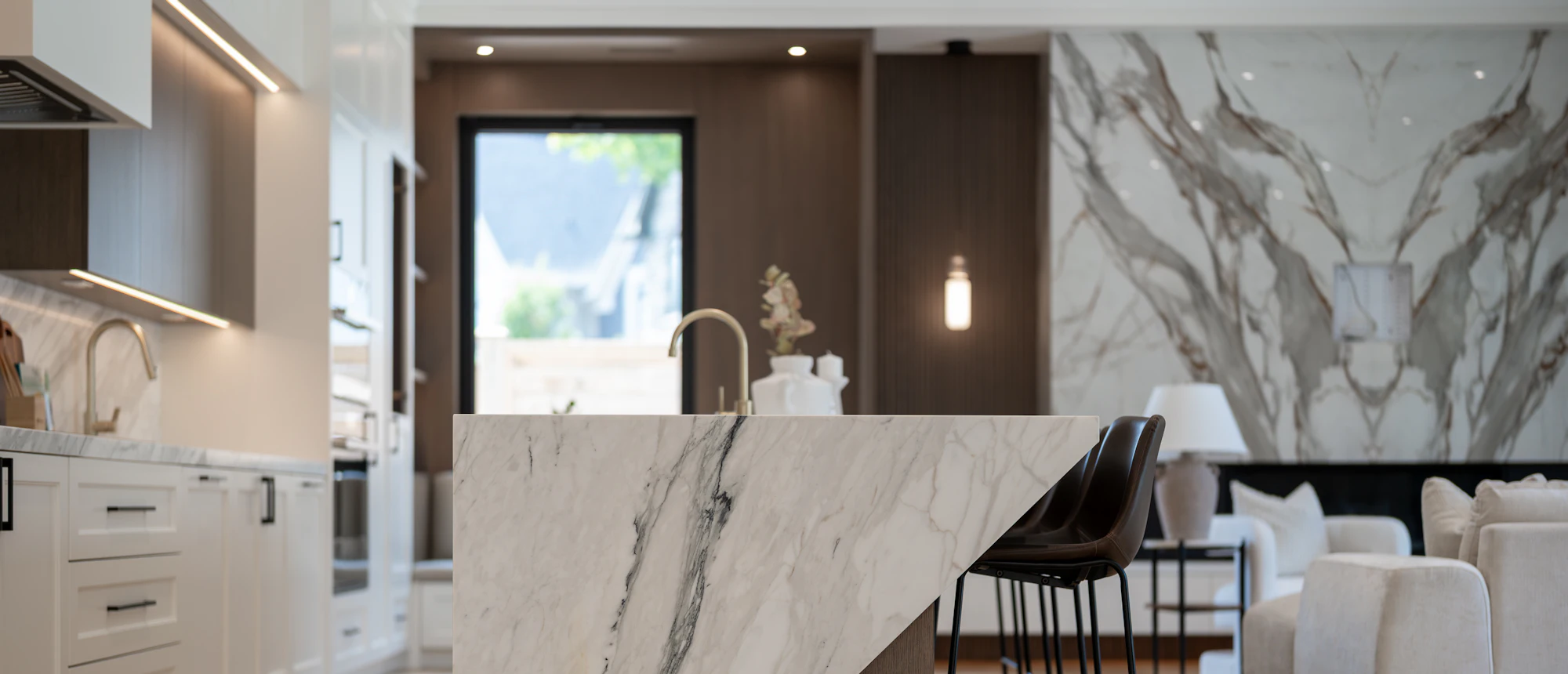 A modern kitchen with a large marble island
