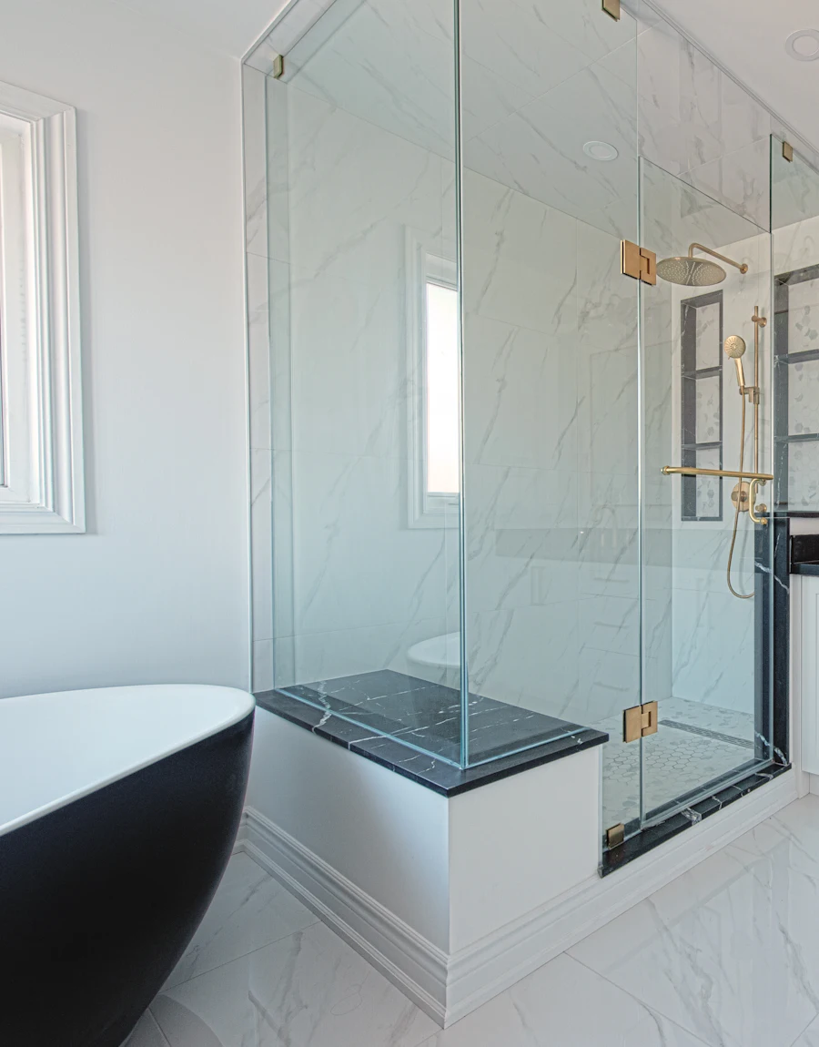 A bathroom with a freestanding tub and glass shower