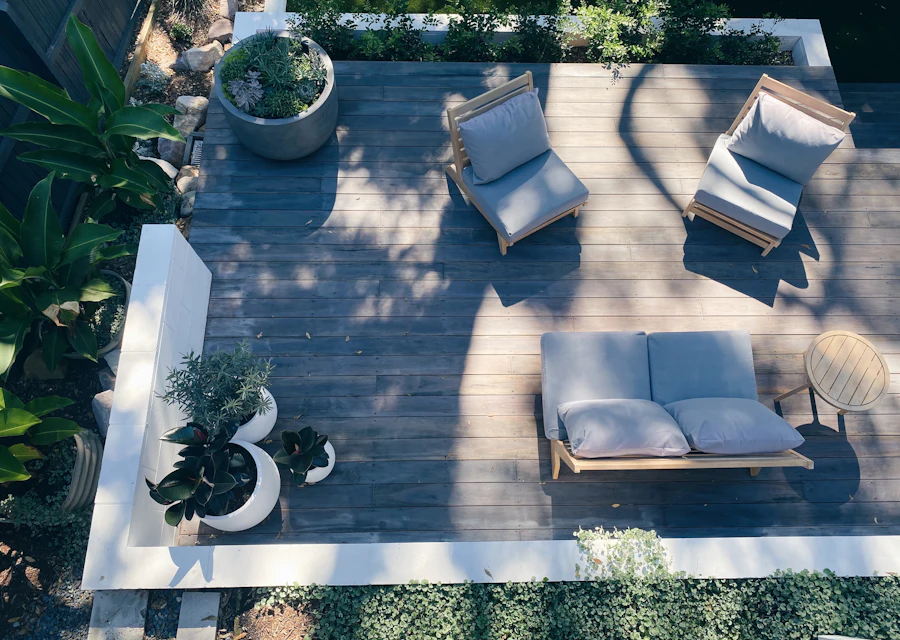 An aerial view of a backyard deck and seating